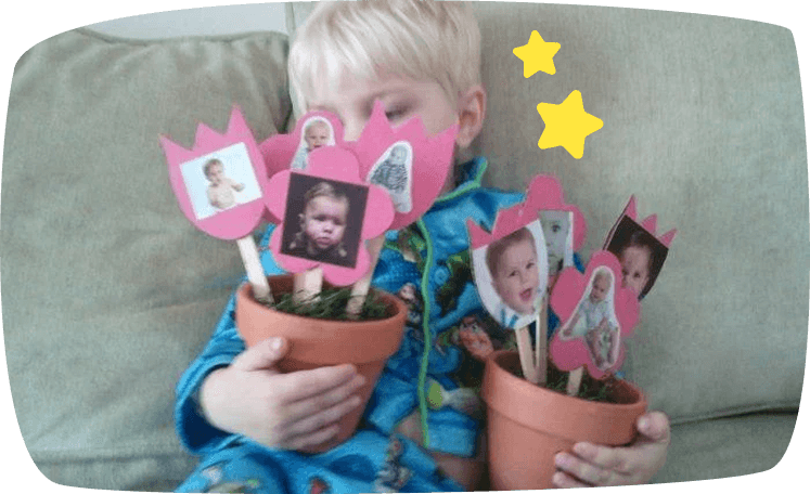 kid holding pots with photos