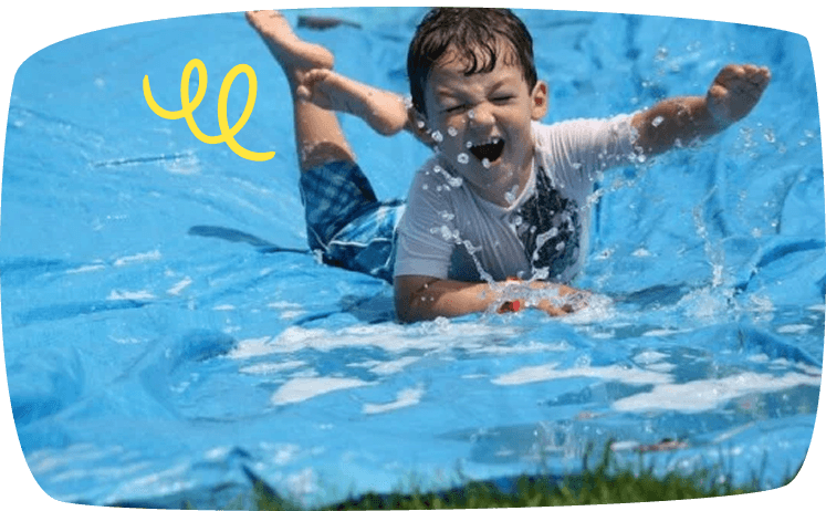 kid slinding down waterslide